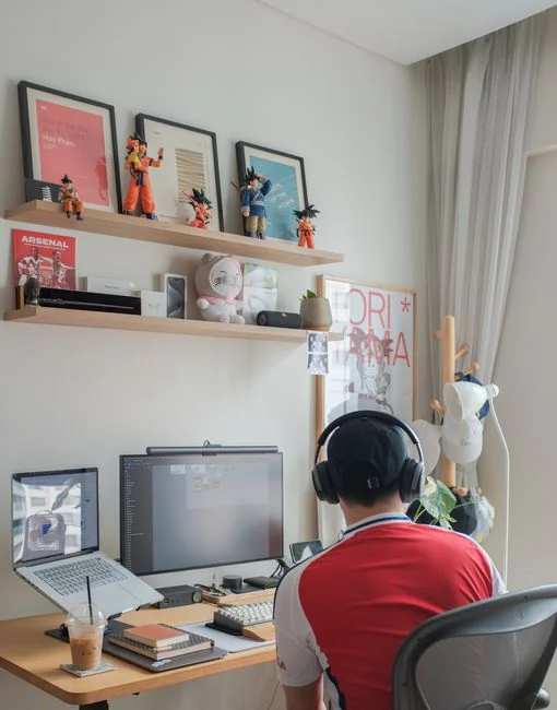 A person using a laptop to browse stock photo websites. Freelancing work in a cozy setting.